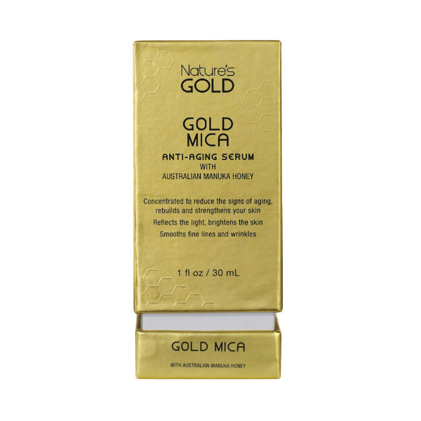 Front side of a box of Nature's Gold Gold Mica Serum on white background